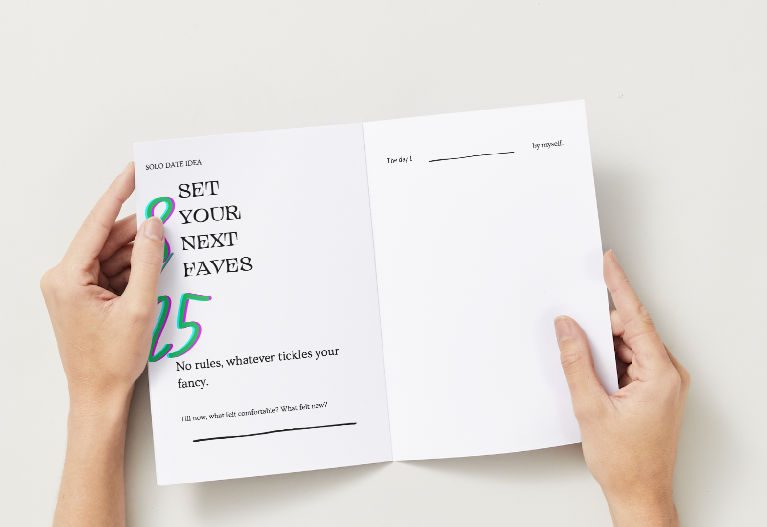 Open book held by hands with text on a white background